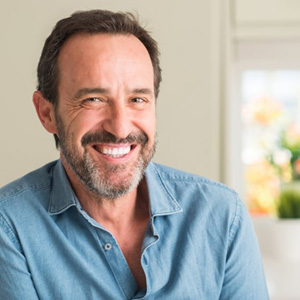 Chicago patient showing youthful implant-supported smile