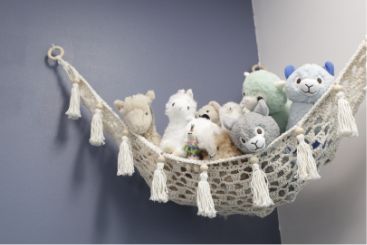 Hammock filled with stuffed alpaca plushes
