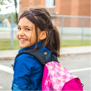 young girl smiling outdoors